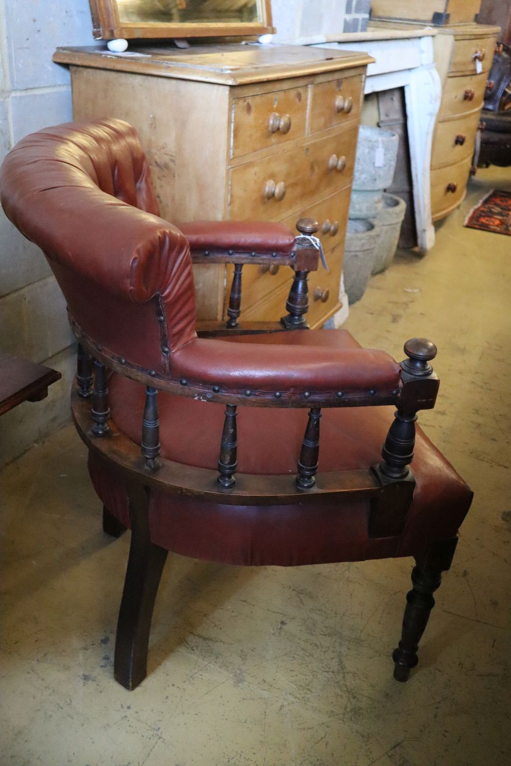 A Victorian mahogany tub frame library chair upholstered in buttoned upholstery, width 66cm